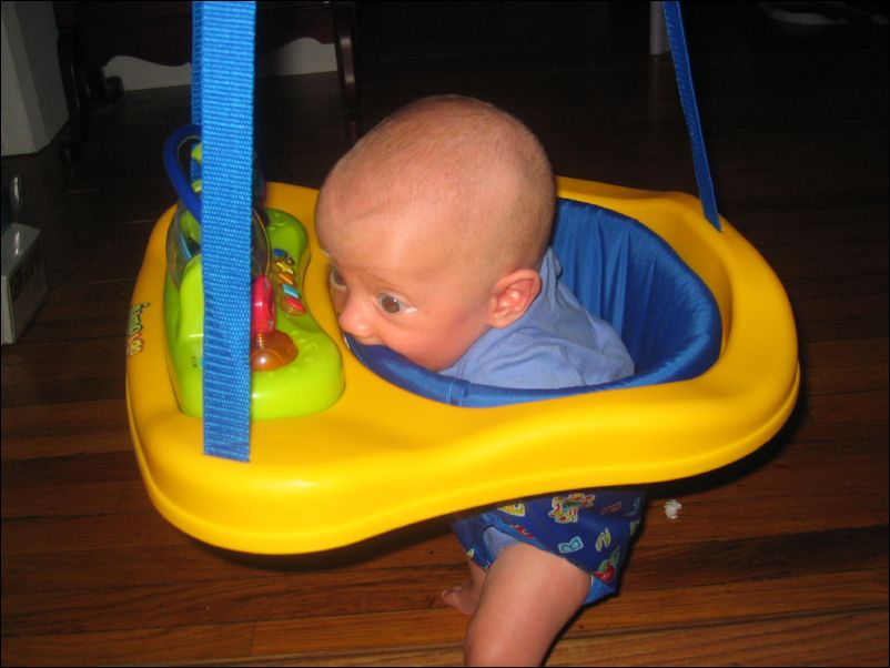 Owen chewing on his bouncy